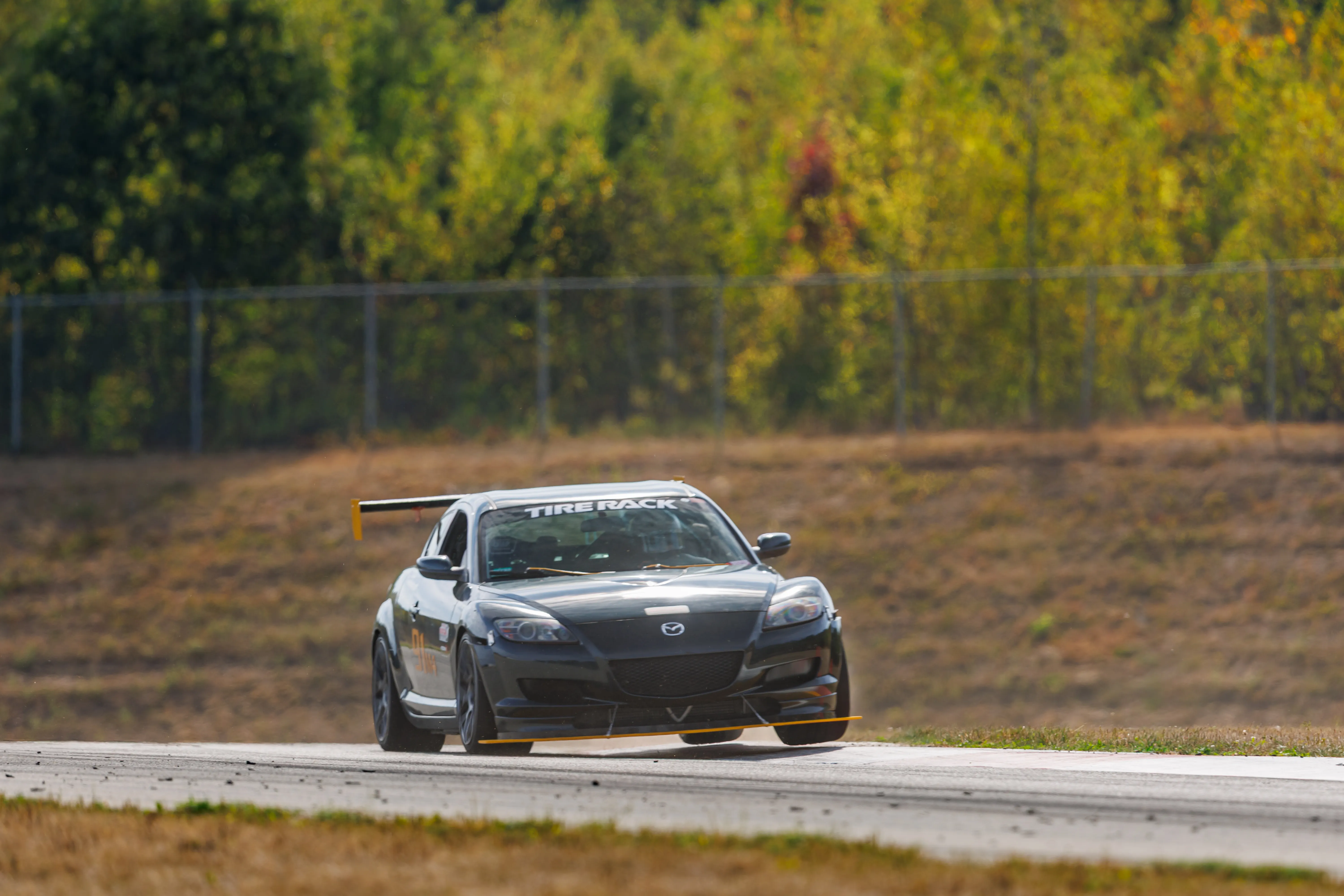 RX8 exiting a corner on track