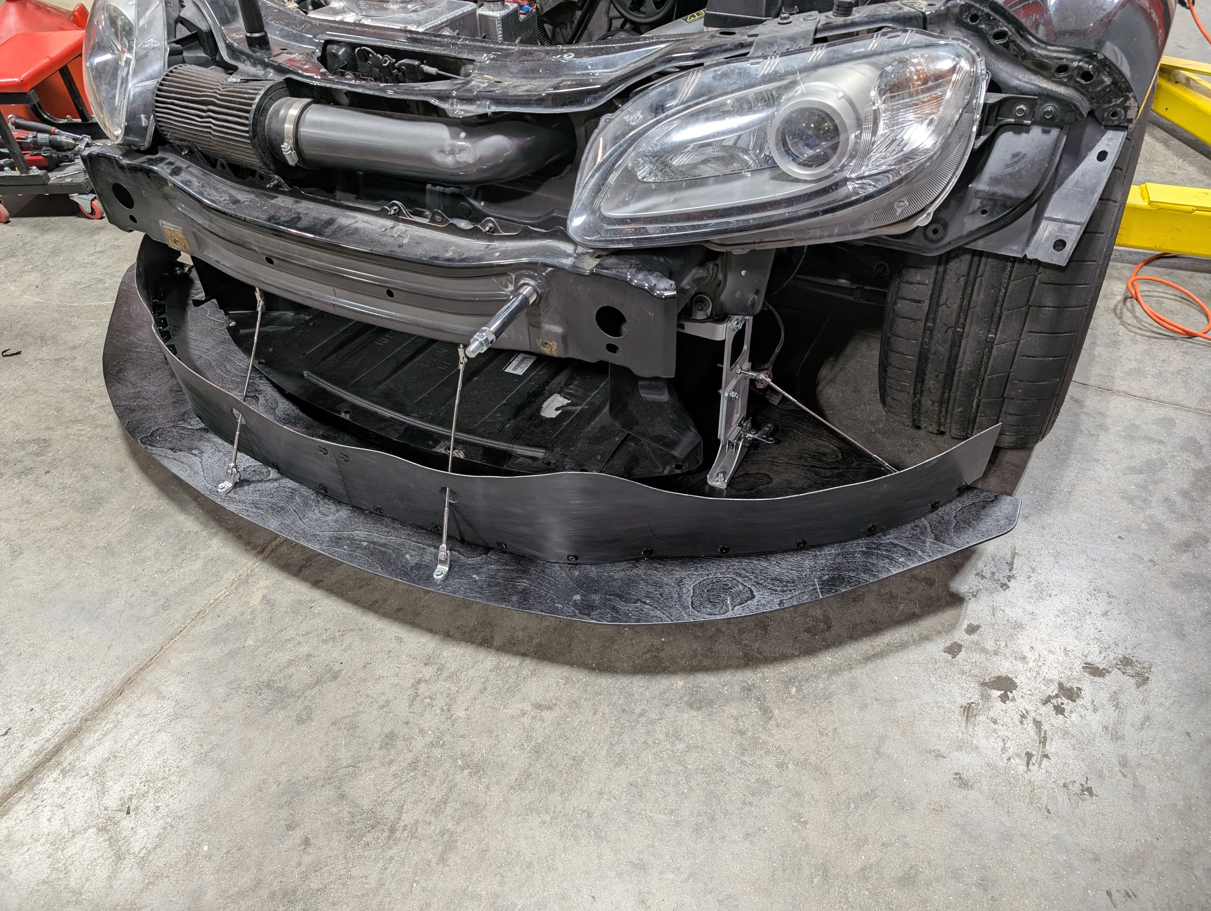 Front splitter installed with quick release cables attached